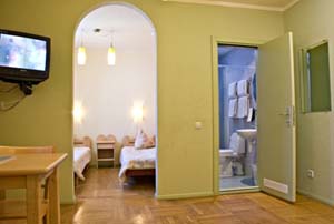 Economy triple with city view, private facilities (shower), and breakfast